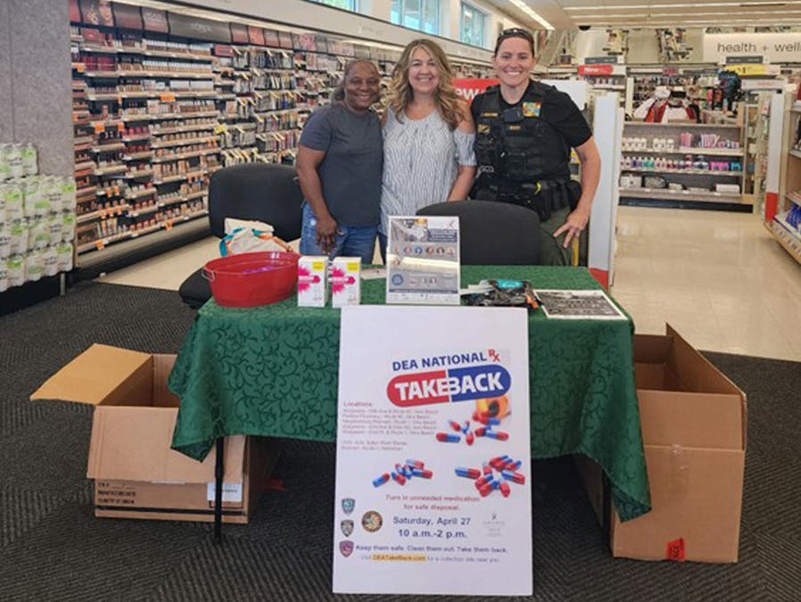 3 people at DEA Takback event